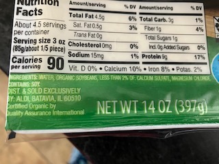 a close up of the ingredients and nutrition facts on a Extra Firm organic Earth Grown brand tofu package
